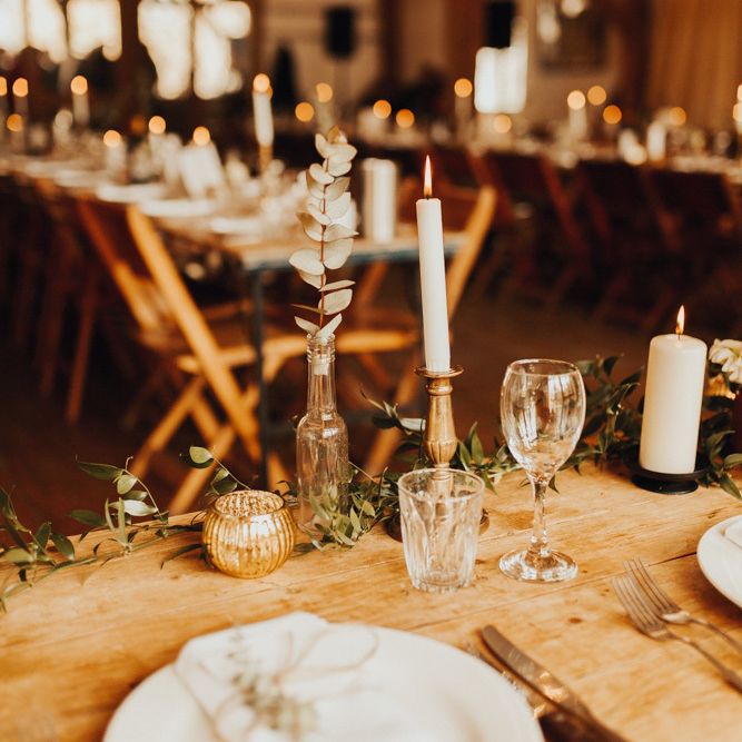Candle wedding table decor with foliage table runner