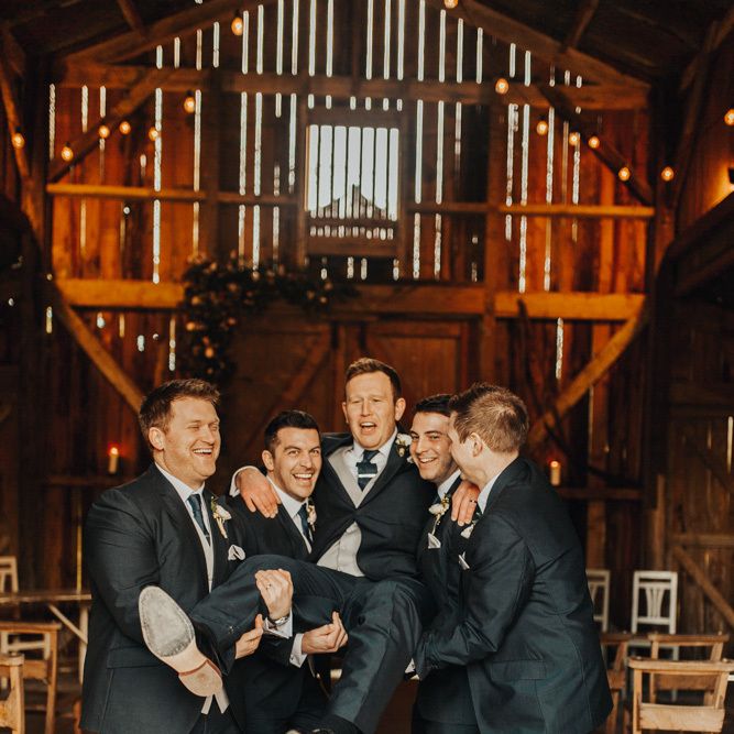 Groom and groomsmen in matching suits at Nancarrow Farm