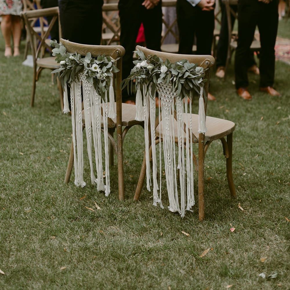 Macrame Chair Backs &amp; Foliage Garlands | Outdoor Wedding Ceremony | Outdoor Boho Wedding at Chateau le Tour, France | Adam and Grace Photography | Head and Heart Films