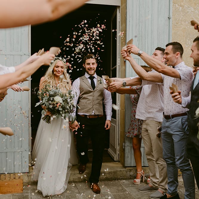 Confetti Exit | Bride in Daalarna Bridal Gown | Groom in Waistcoat | Outdoor Boho Wedding at Chateau le Tour, France | Adam and Grace Photography | Head and Heart Films