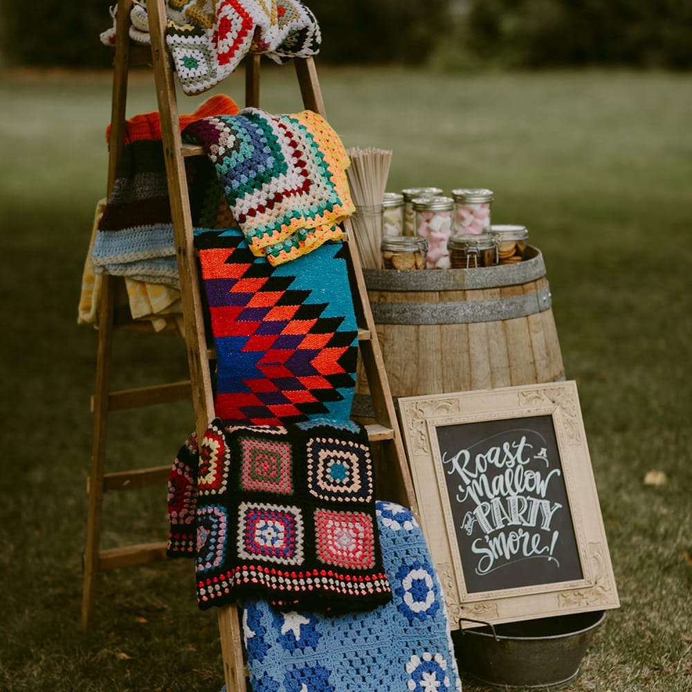 Smore's and Blankets | Trestle Tablescape | Festoon Lit Outdoor Boho Wedding at Chateau le Tour, France | Adam and Grace Photography | Head and Heart Films
