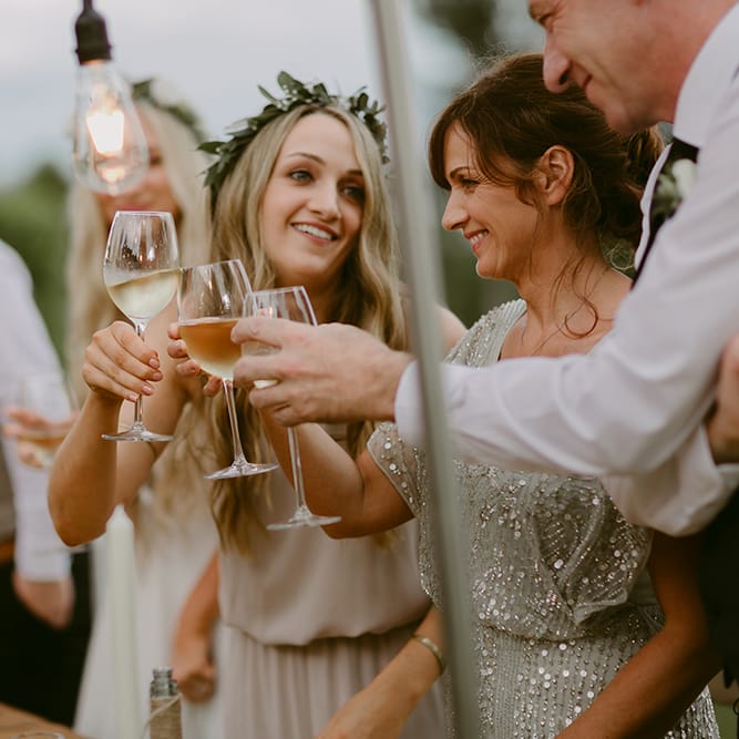 Cheers | Festoon Lit Outdoor Boho Wedding at Chateau le Tour, France | Adam and Grace Photography | Head and Heart Films