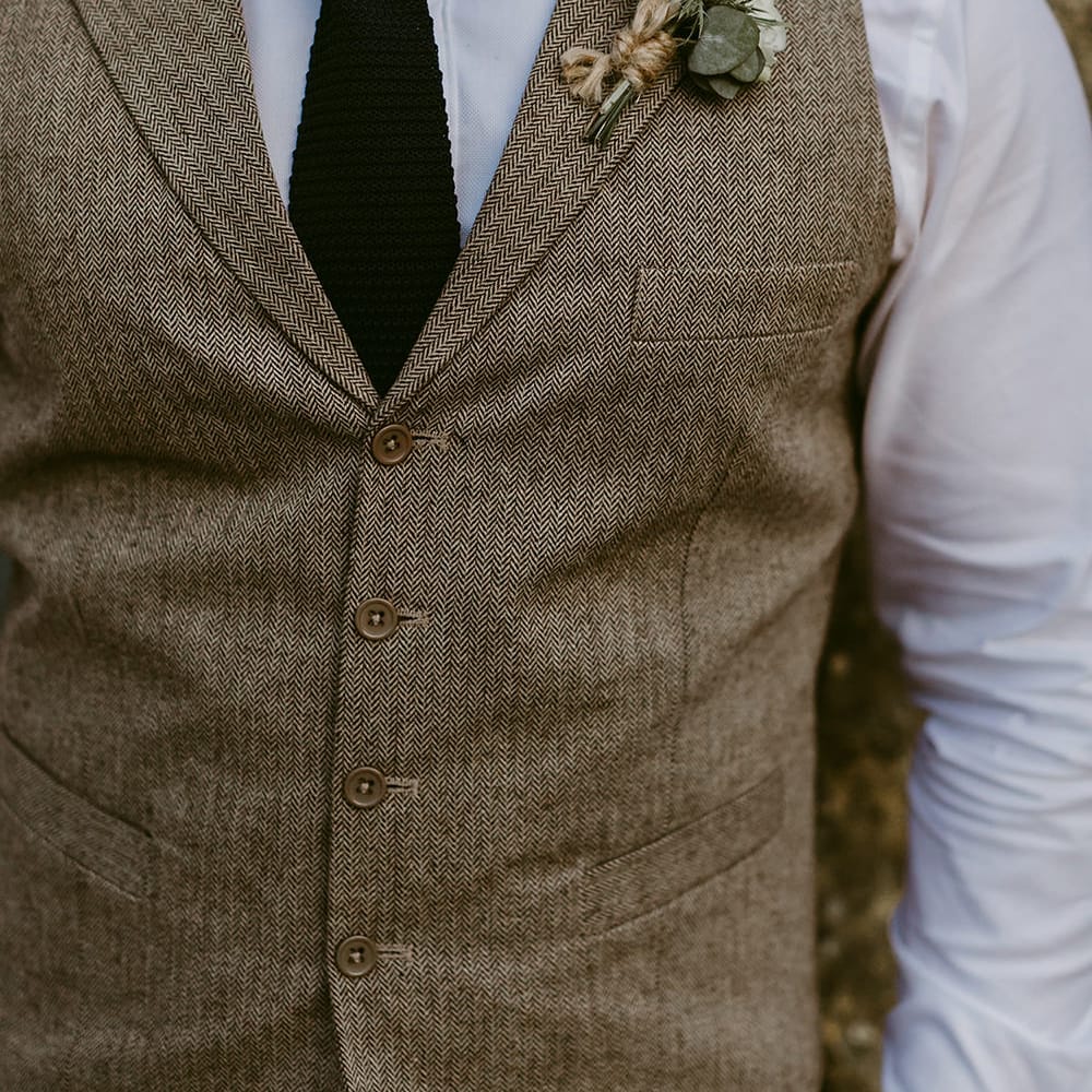 Groom in Waistcoat | Buttonhole | Outdoor Boho Wedding at Chateau le Tour, France | Adam and Grace Photography | Head and Heart Films