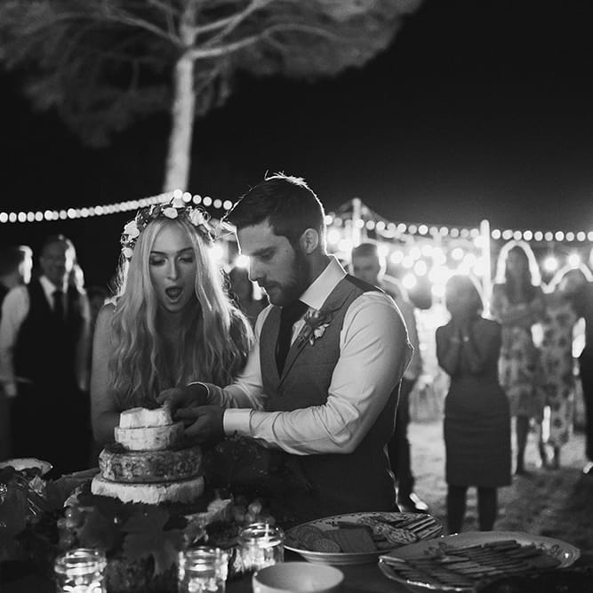 Cutting the Cake | Bride in Daalarna Bridal Gown | Groom in Waistcoat | Outdoor Boho Wedding at Chateau le Tour, France | Adam and Grace Photography | Head and Heart Films