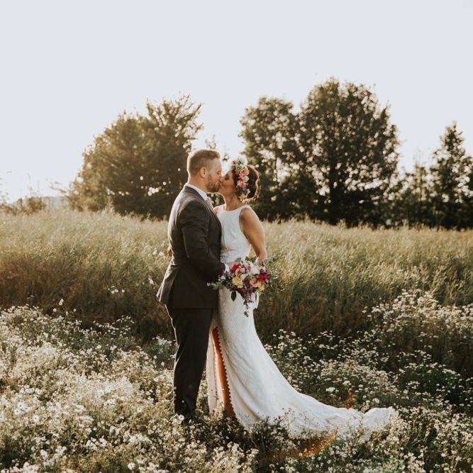 Grace Loves Lace wedding dress with bright bouquet