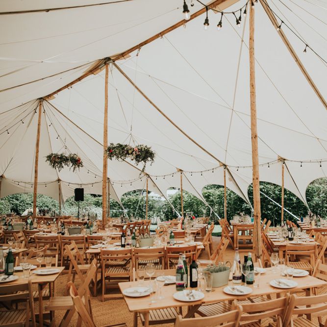 Marquee garden wedding for celebration with different bridesmaid dresses