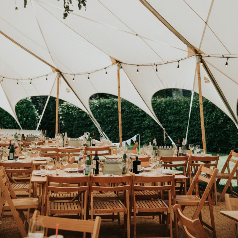 Festoon lighting in marquee wedding