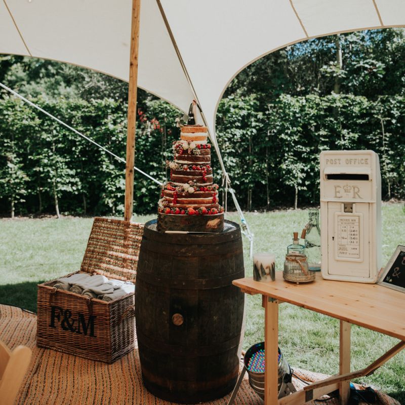 Naked wedding cake on barrel stand