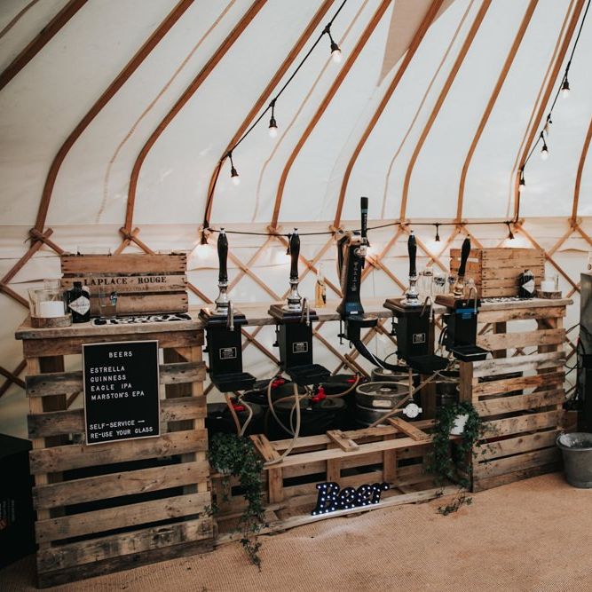 Rustic wedding bar in marquee