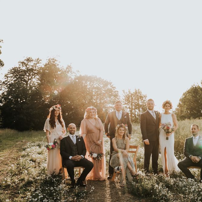 Bridal party in different bridesmaid dresses with hoop bouquets