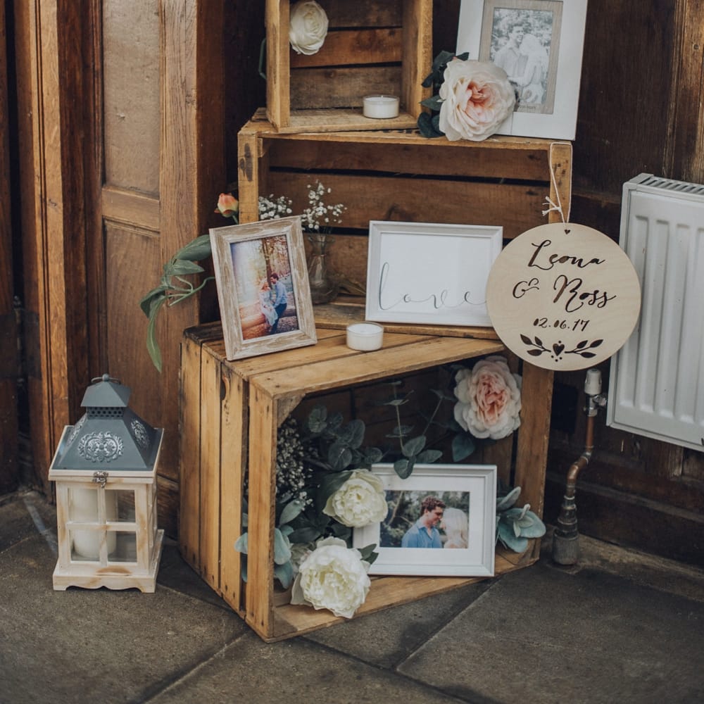 Rustic Wedding Photo Display For Wedding // Pink Ruffled Chair Covers For Romantic Pastel Pink Wedding At Dorton House With Bride In La Sposa And Images From Julia &amp; You Photography