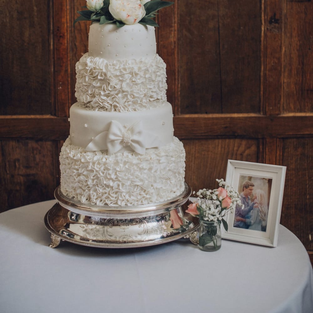 Iced Wedding Cake With Personalised Cake Topper // Pink Ruffled Chair Covers For Romantic Pastel Pink Wedding At Dorton House With Bride In La Sposa And Images From Julia &amp; You Photography