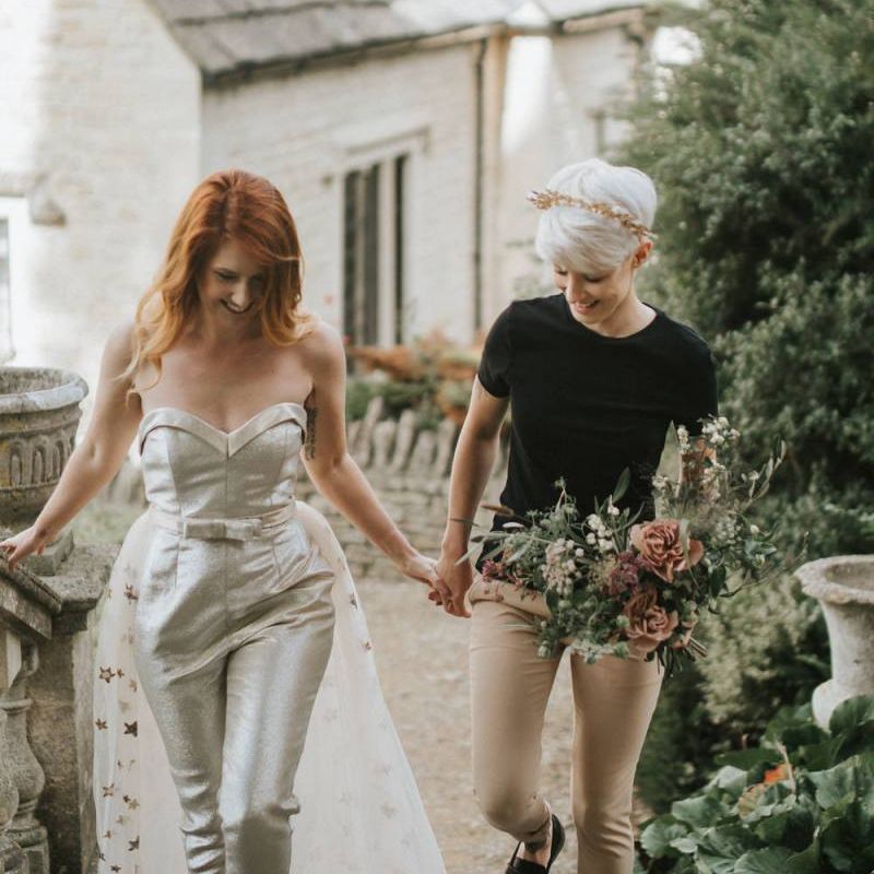 Bride with short hair wearing a gold crown and black t shirt