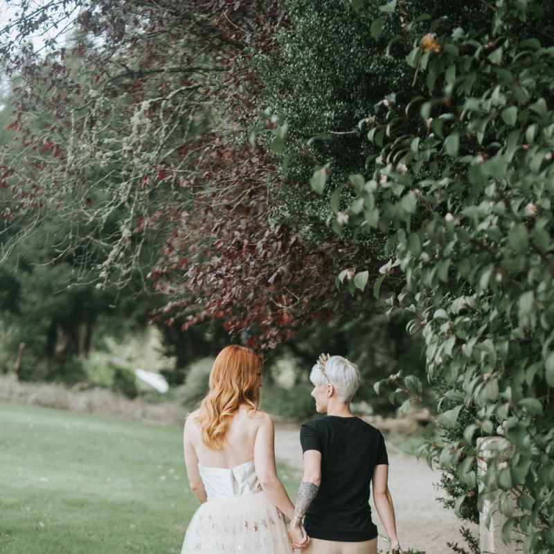 Bride in gold jumpsuit with star covered train