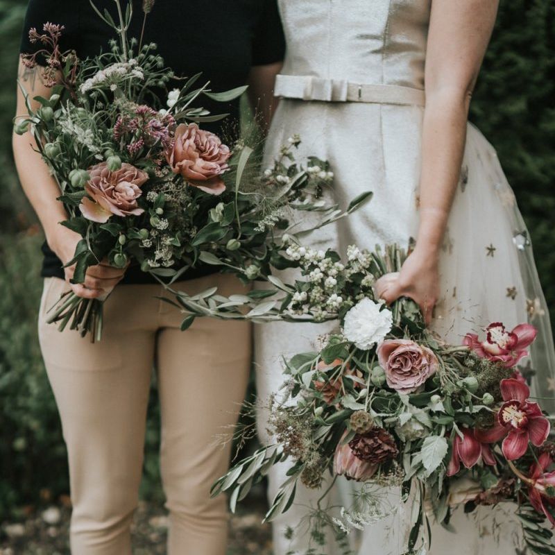 Two brides with complementing wedding bouquets