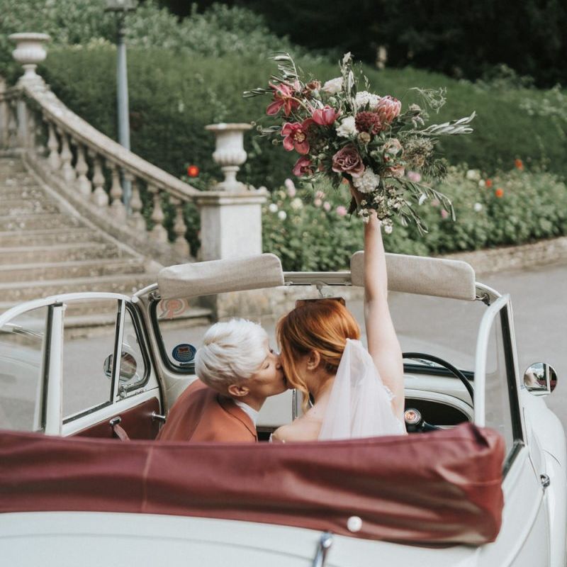 Brides in a wedding car for LGBTQ+ wedding inspiration