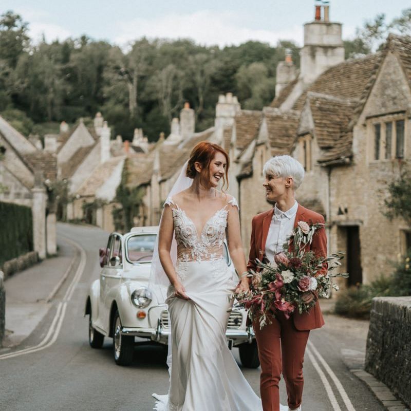 Same sex marriage with brides in a wedding dress and coloured suit