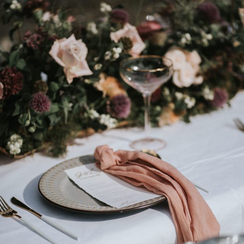 place setting with blush linen napkin