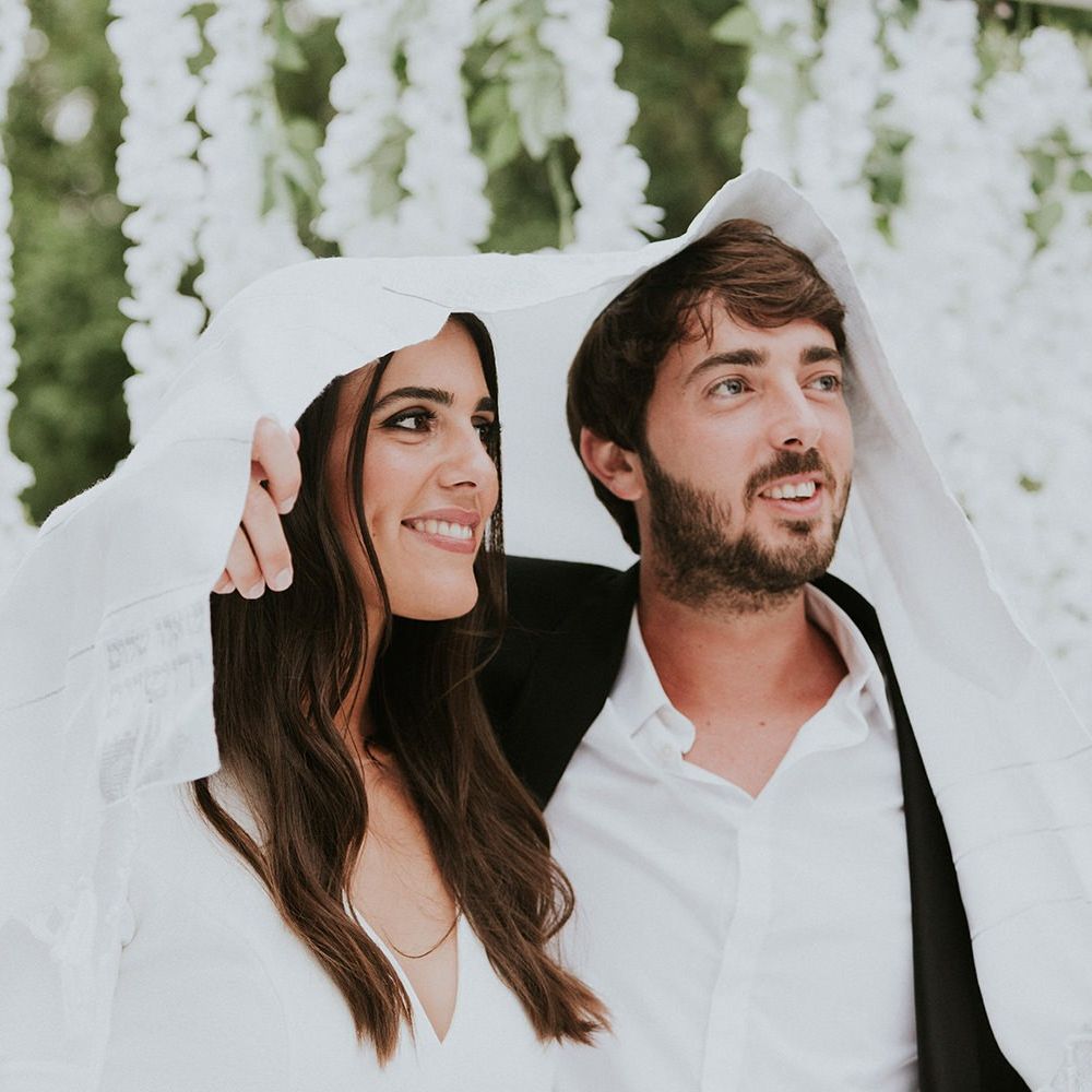 Bride and groom during Jewish wedding ceremony