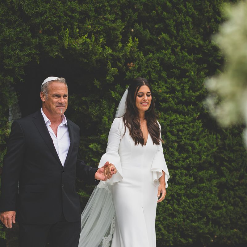 Bride in Pronovias wedding dress with veil
