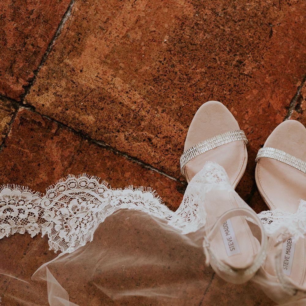 Silver bridal shoes with lace trim veil