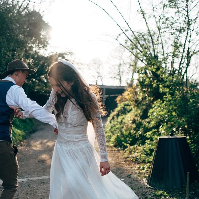 Nancarrow Farm Cornwall Wedding With Images From Dale Weeks &amp; Bride In Maggie Sottero With Wild Flower Bouquet &amp; Hand Knitted Flower Girl Outfit