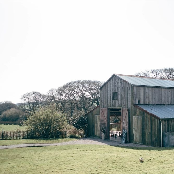 Nancarrow Farm Cornwall Wedding With Images From Dale Weeks &amp; Bride In Maggie Sottero With Wild Flower Bouquet &amp; Hand Knitted Flower Girl Outfit