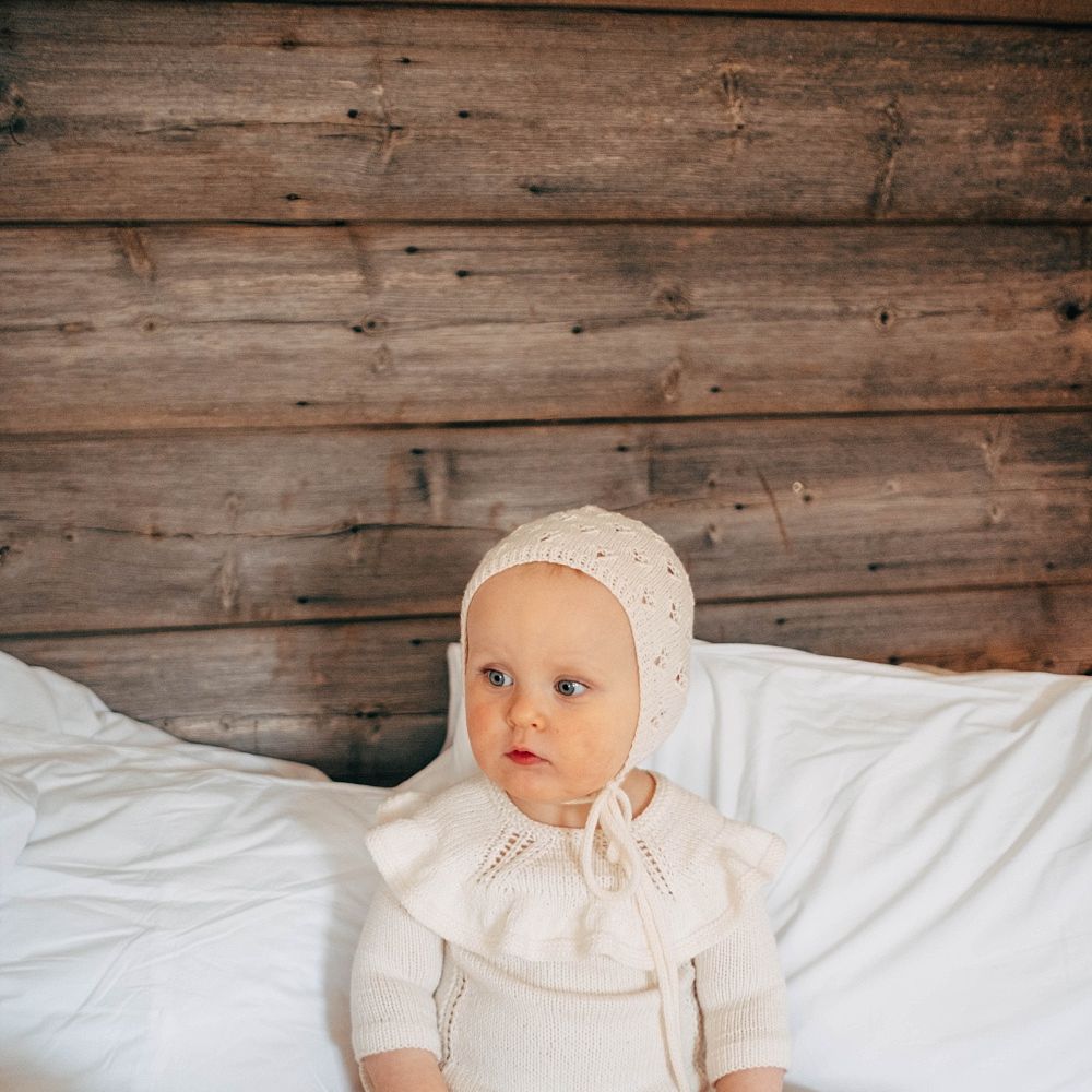 Flower Girl With Knitted Bonnet // Nancarrow Farm Cornwall Wedding With Images From Dale Weeks &amp; Bride In Maggie Sottero With Wild Flower Bouquet &amp; Hand Knitted Flower Girl Outfit