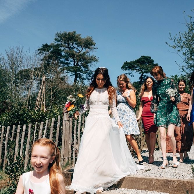 Nancarrow Farm Cornwall Wedding With Images From Dale Weeks &amp; Bride In Maggie Sottero With Wild Flower Bouquet &amp; Hand Knitted Flower Girl Outfit