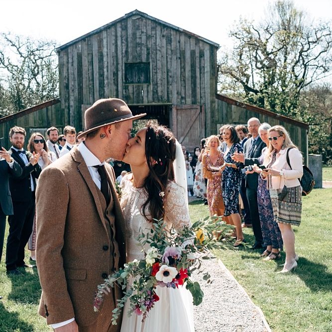 Just Married // Rusty Barn Wedding Ceremony Space At Nancarrow Farm // Nancarrow Farm Cornwall Wedding With Images From Dale Weeks &amp; Bride In Maggie Sottero With Wild Flower Bouquet &amp; Hand Knitted Flower Girl Outfit