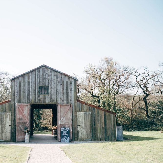 Nancarrow Farm Cornwall Wedding With Images From Dale Weeks &amp; Bride In Maggie Sottero With Wild Flower Bouquet &amp; Hand Knitted Flower Girl Outfit