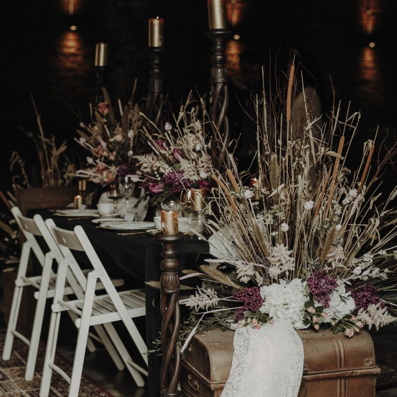 Tablescape with Wooden Chairs, Vintage Trunk and Dried Flower Arrangements