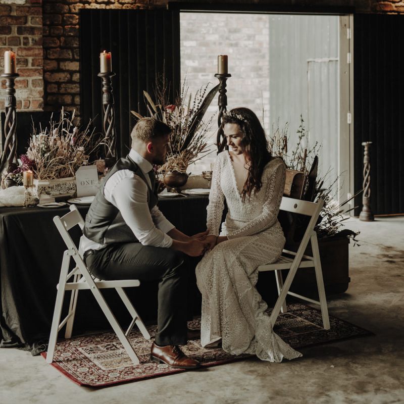 Boho Bride and Groom Sitting at Rustic TableScape in The Engine Works Glasgow