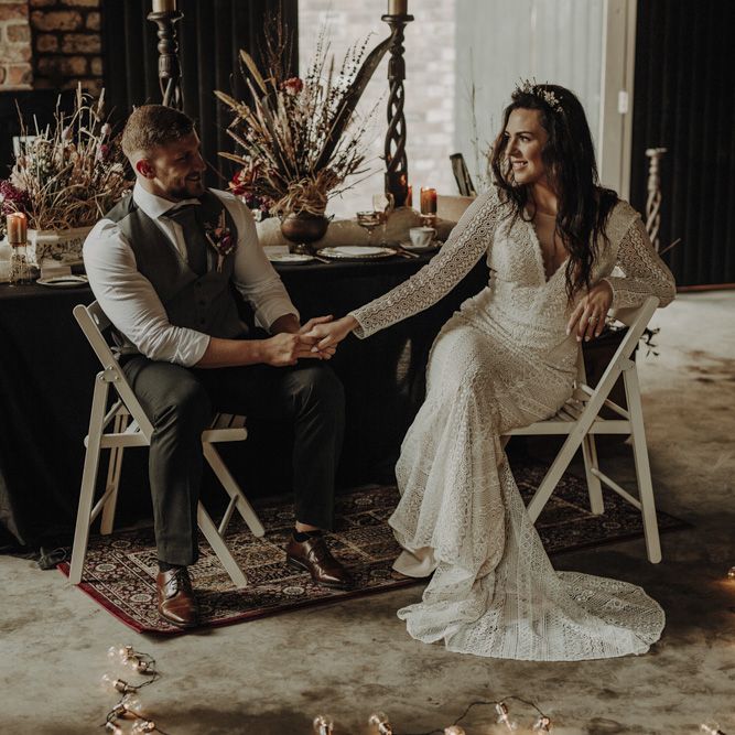 Boho Bride and Groom Holding Hands at Rustic TableScape in The Engine Works Glasgow