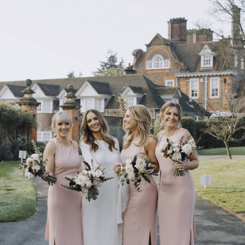 Bridal Party Portrait with Bridesmaids in Pink Whistles Dresses and Bride in Emma Beaumont Wedding Dress