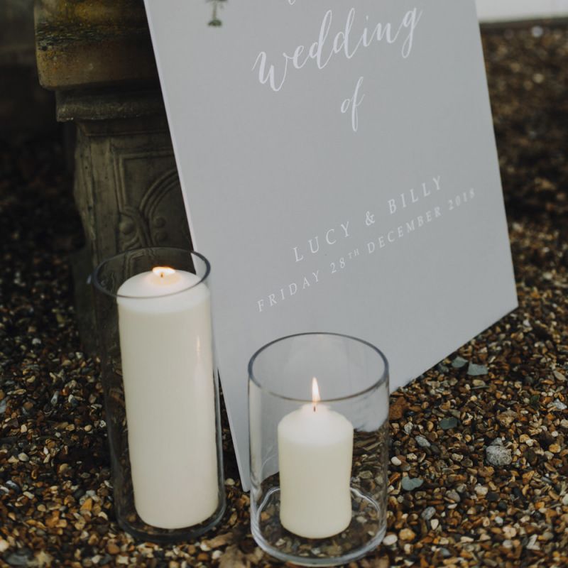Grey Wedding Welcome Sign with White Calligraphy Writing and Candle Decor
