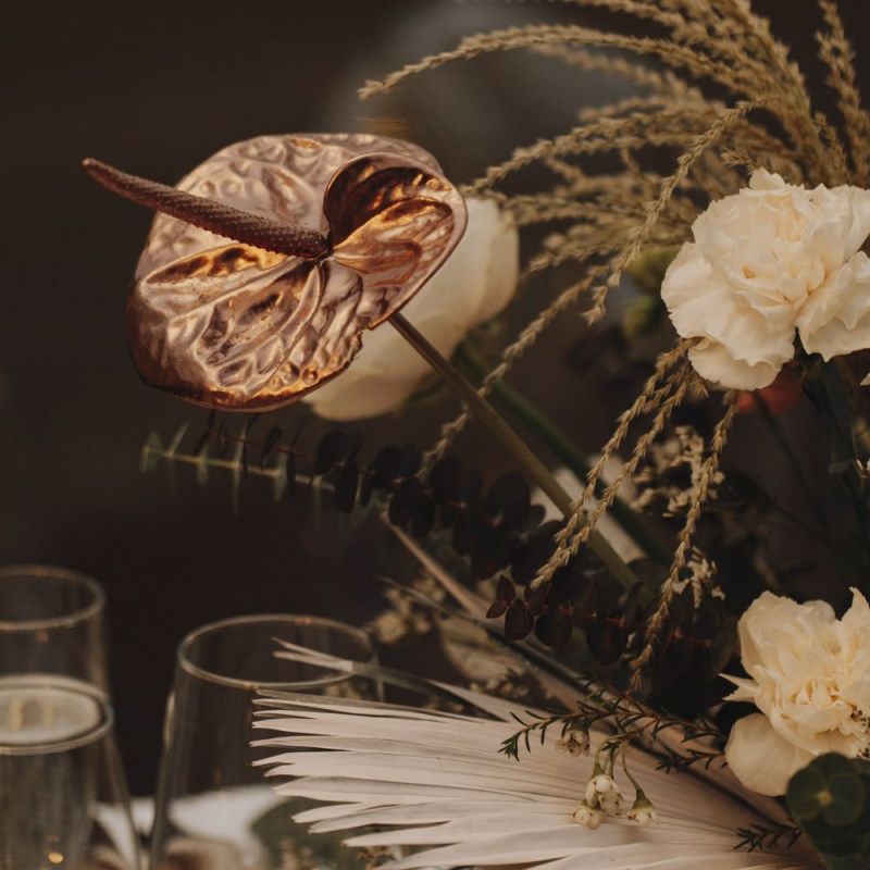 Dried Palm Leaf, Spray Painted Lily and Muted Flower Arrangement