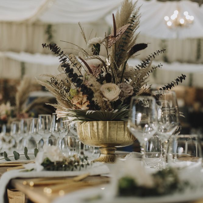 Wedding Flower Arrangement in Gold Vessel with Pampas Grass, Feathers, Muted Roses and Foliage