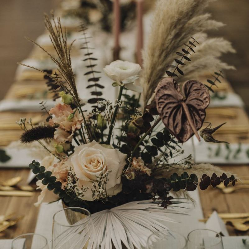 Wedding Flower Centrepiece in Gold Vessel with Pampas Grass, Feathers, Muted Roses and Foliage