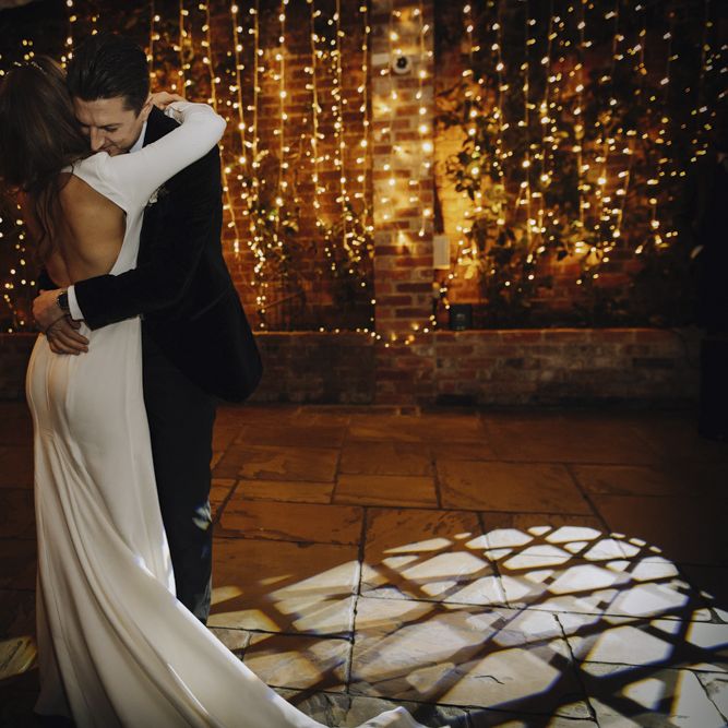 First Dance with Bride in Backless Emma Beaumont Wedding Dress and Groom in Tuxedo