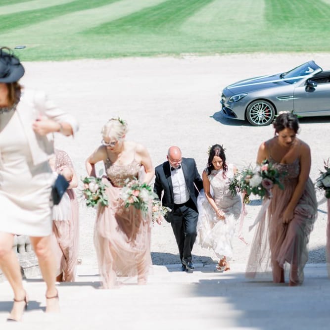 Bridal party arrives at Lulworth Castle wedding
