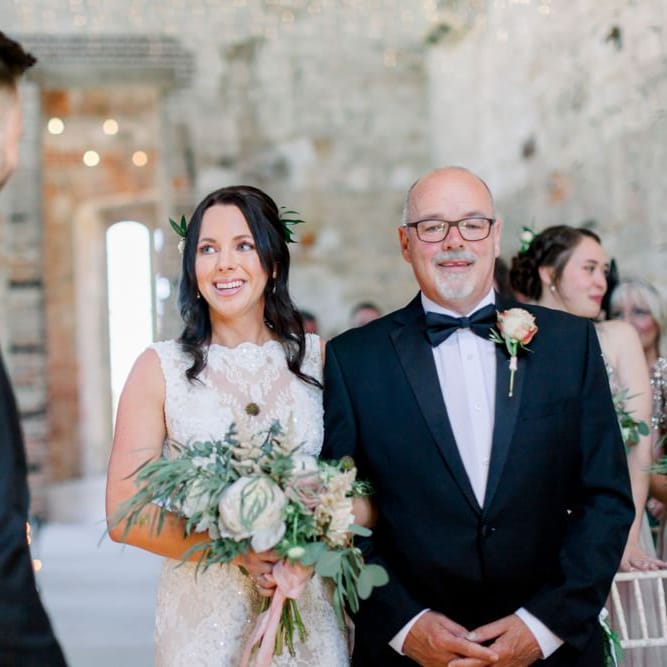 Bride greets her husband to be at altar