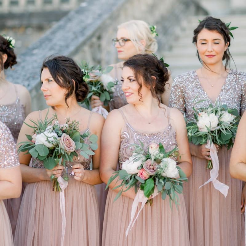 Pink bridesmaid dresses with beautiful bouquet