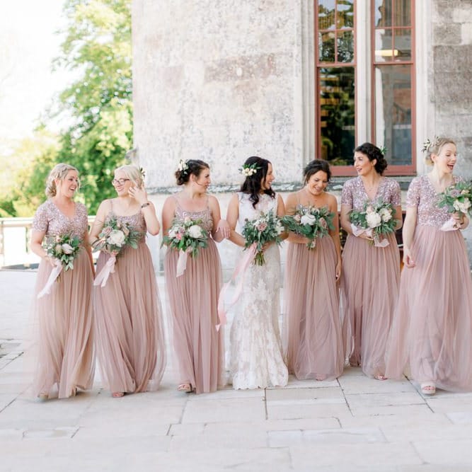 Pink bridesmaid dresses with beautiful bouquet