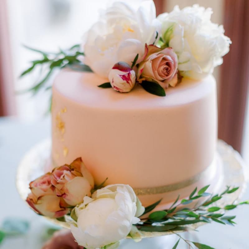 Pink wedding cake with flower decor