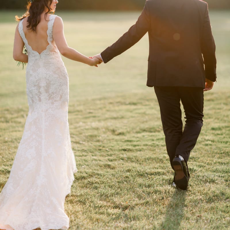 Low back lace wedding dress with floral hairpiece