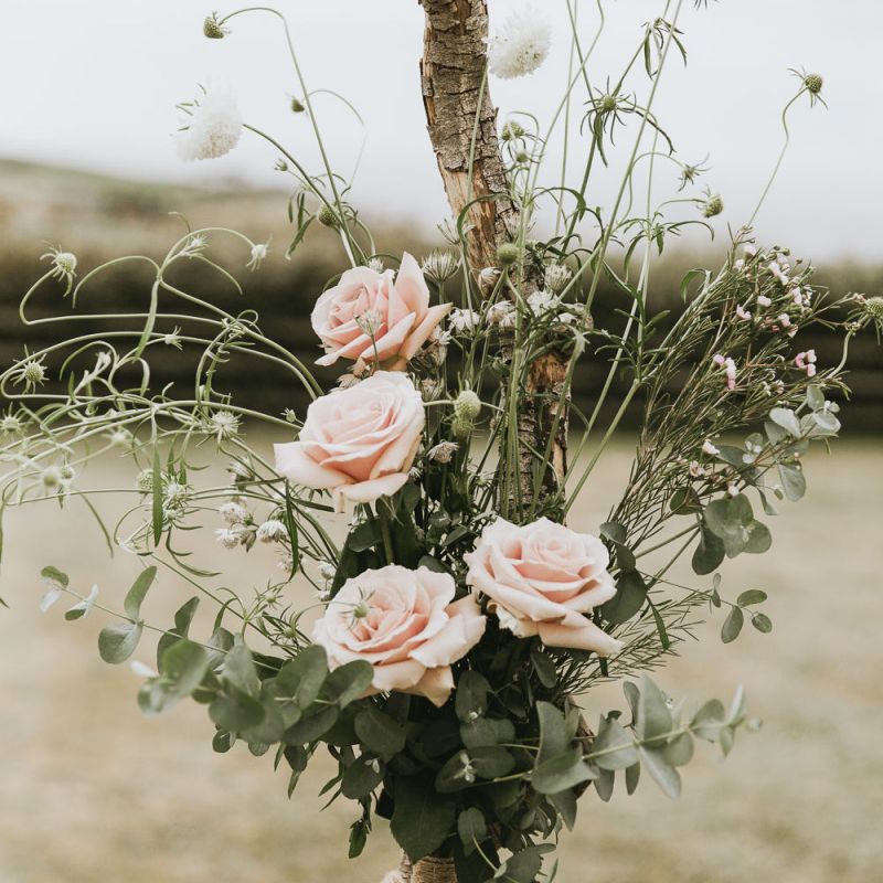 Wildflowers line the aisle at vegan wedding