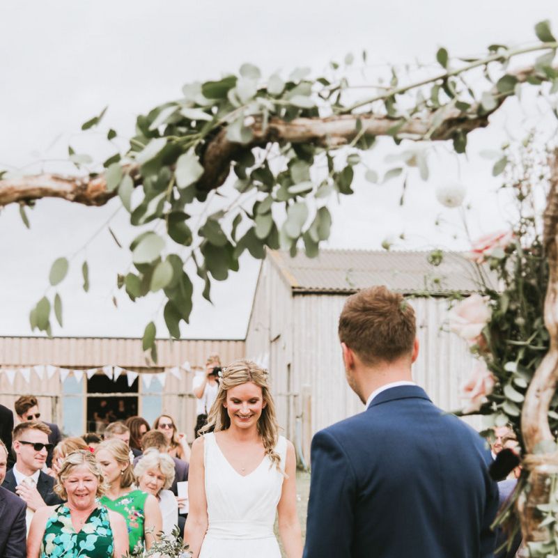 Bride and groom during outdoor ceremony