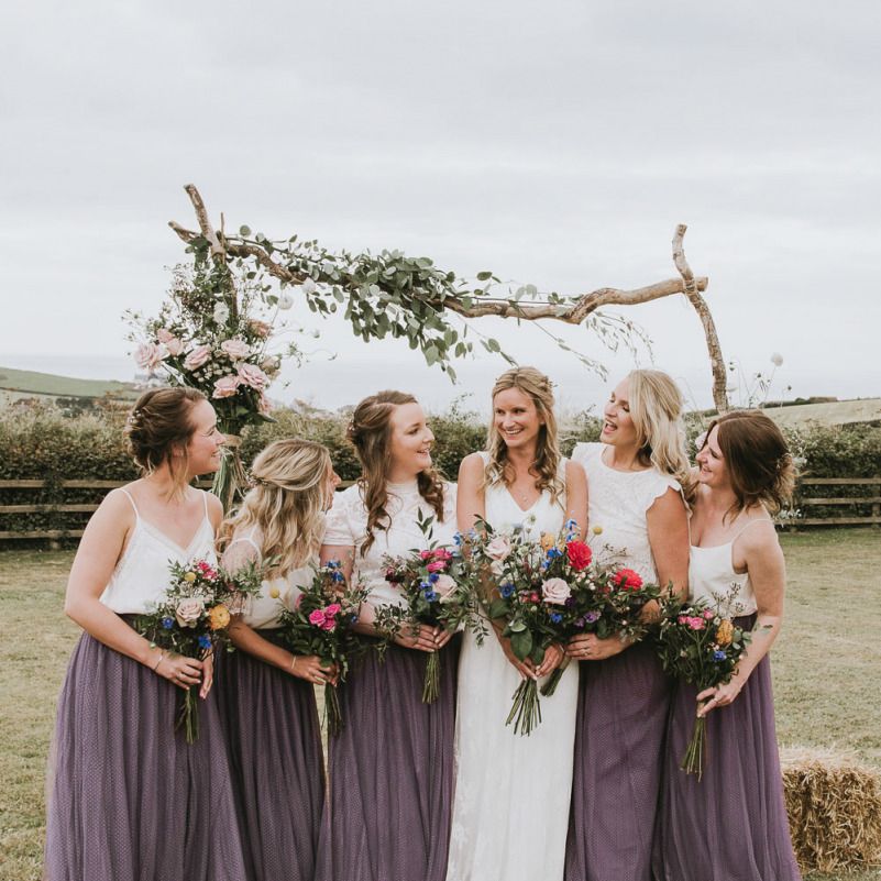 Bridal party with wildflower bouquets at vegan wedding