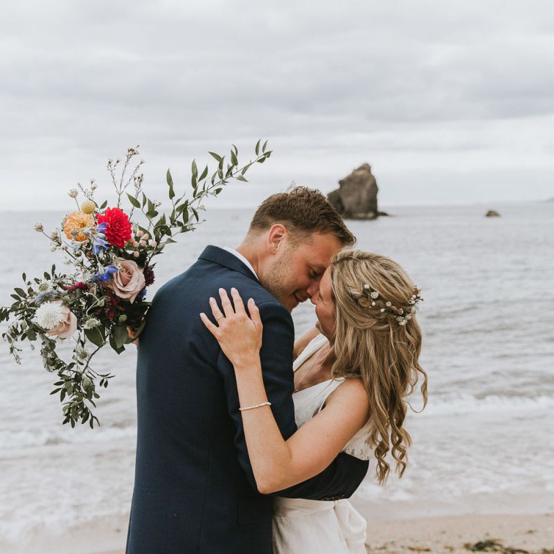 Coastal wedding in Devon with wildflower bouquet